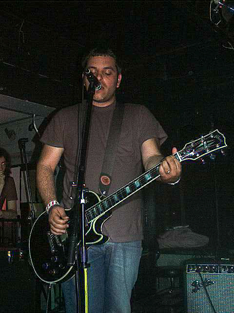 jason martin playing a guitar and singing.